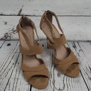 Tan strappy heels by Anna Foret